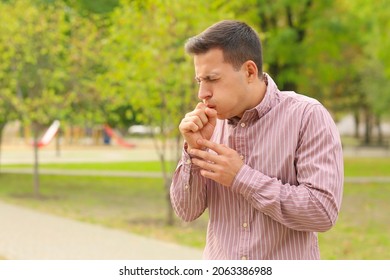 Young Man Suffering From Allergy Outdoors