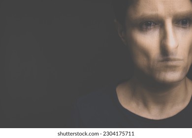 Young man suffering from anxiety, depression due to social seclusion, isolation, COVID induced lockdown - Shutterstock ID 2304175711