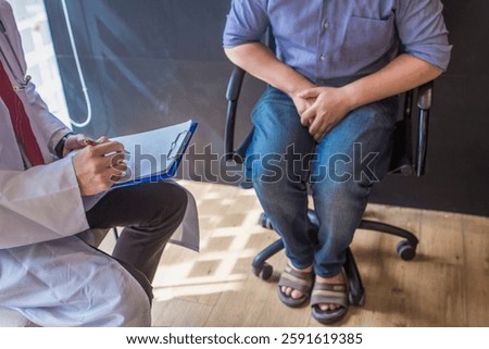 A young man suffering from erectile dysfunction seeks consultation with a specialist to identify the cause of his erectile dysfunction and seek treatment or cure for the erectile dysfunction.