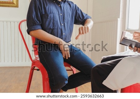 A young man suffering from erectile dysfunction seeks consultation with a specialist to identify the cause of his erectile dysfunction and seek treatment or cure for the erectile dysfunction.