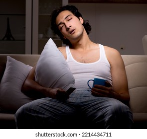 Young Man Suffering At Home Night Time