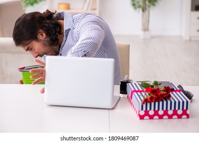 Young Man Suffering From Indigestion Christmas Time