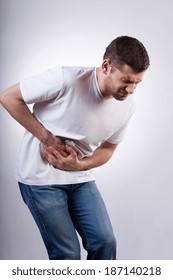 Young Man Suffering From Stomach Ache