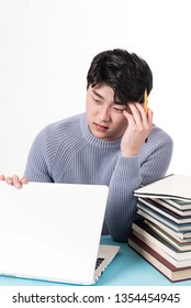 a young man suffering from studying stress. - Shutterstock ID 1354454945
