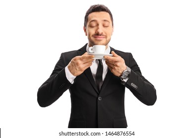 Young Man In A Suit Enjoying The Smell Of A Coffee Isolated On White Background