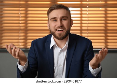 Young Man In Suit Holding Online Webinar Indoors, View From Webcam