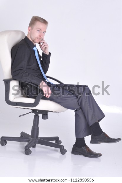 Young Man Suit Tie Sitting Chair Stock Photo Edit Now 1122850556