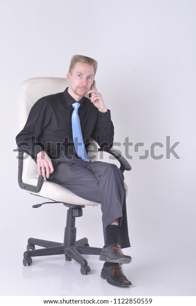 Young Man Suit Tie Sitting Chair Stock Photo Edit Now 1122850559