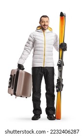 Young man with a suitcase and pair of skiis isolated on white background