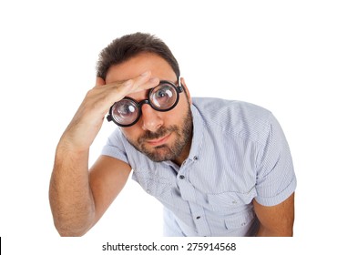 Young Man With A Surprised Expression And Thick Glasses On White Background.