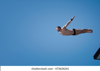 Young Man Swan Diving From 10 Meter High Platform