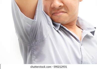 Young Man With Sweat Under The Armpit And Have A Foul Odor /  Health And Medicine Concepts 