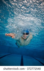 Young Man Swimming In Pool