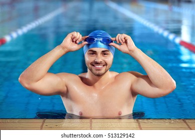 Young man in swimming pool - Powered by Shutterstock