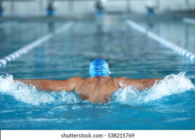Young man swimming in pool