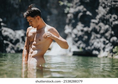 A young man swims in a serene natural outdoor water setting. The moment captures relaxation and nature's beauty. - Powered by Shutterstock