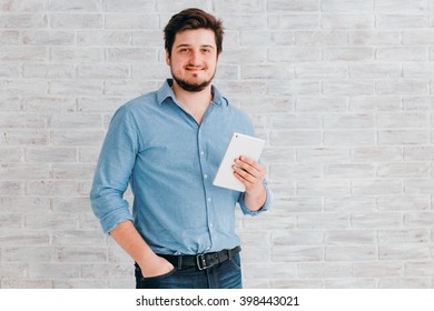 young man with tablet in Studio - Shutterstock ID 398443021