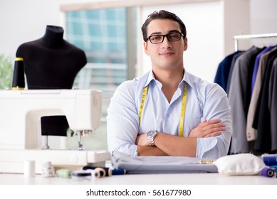 Young man tailor working on new clothing - Powered by Shutterstock