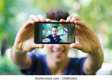 Young Man Taken A Self Photo With His Cellphone