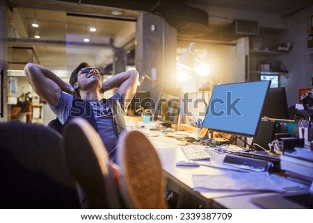 Young man taking a break while working in a startup company office