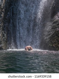 A Young Man, Taking An Dive, Just Under The Fonias Waterfall, At Samothrace, Greece