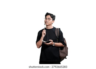 Young Man Taking Notes in Notebook While Wearing Backpack