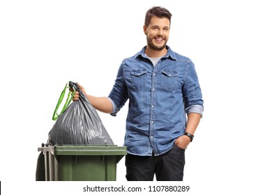 Young Man Taking Out The Garbage Isolated On White Background