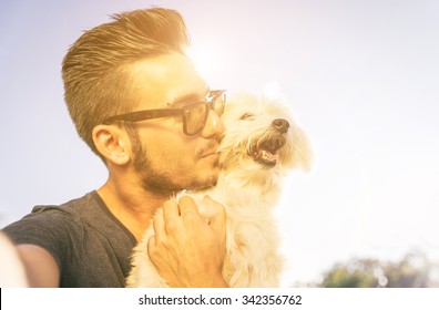 Young Man Taking Selfie With His Cute Dog Outdoor. Animals And Love For Them