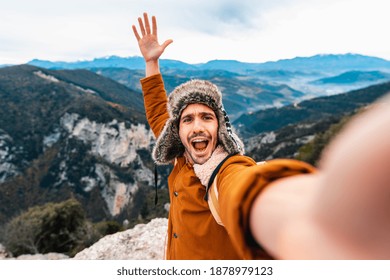 Young Man Taking A Selfie With Mobile Smart Phone Hiking Mountains - Happy Smiling Guy Looking At Camera - Warm Autumn Filter