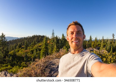 Young Man Taking A Selfie From The Top Of A Mountain In Southern Oregon