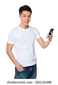 Young man talk to cellphone - Shutterstock ID 283126388