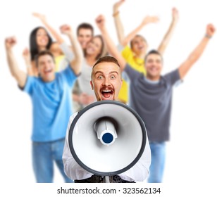 Young man talking in loud-hailer and group of happy people. - Shutterstock ID 323562134