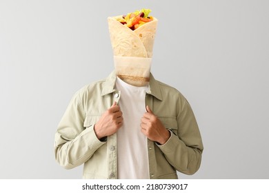 Young Man With Tasty Burrito Instead Of His Head On Light Background