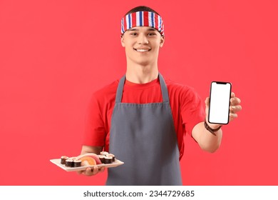 Young man with tasty sushi and mobile phone on red background - Powered by Shutterstock