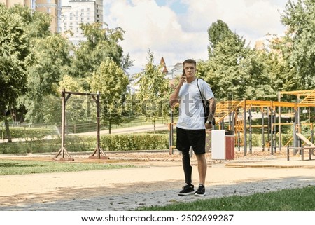 Similar – young tourist walks around the summer city