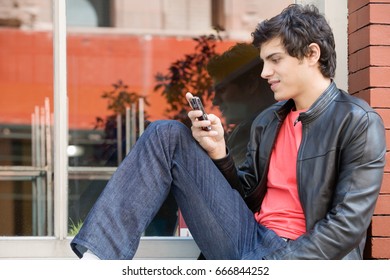 A young man texting