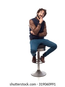 Young Man Thinking With Bar Stool