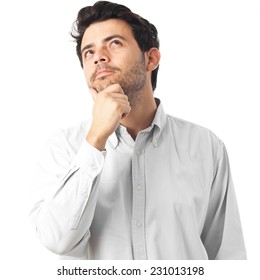 Young Man Thinking On A White Background