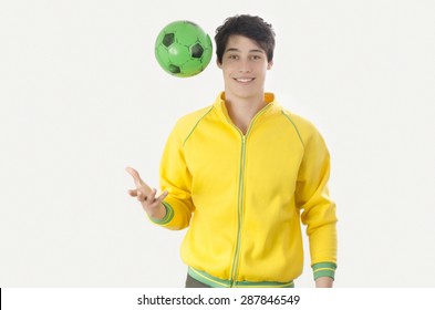 Young Man Throwing A Football Ball. Attractive Man Playing With A Ball In The Hands. Isolated On White.