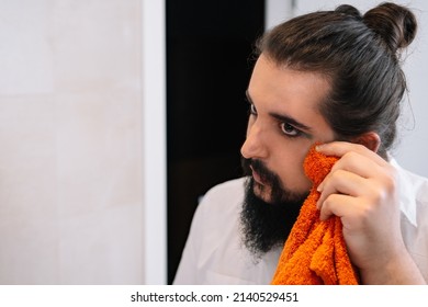 Young Man, Touching Up His Eye Make-up With A Towel