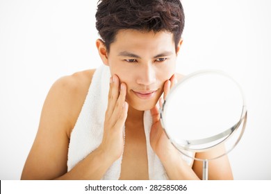 Young  Man Touching His Smooth Face After Shaving