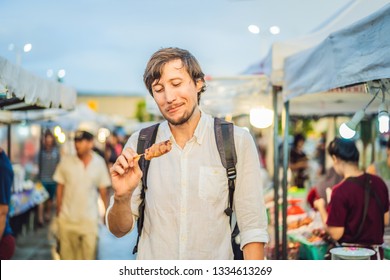 Young Man Tourist On Walking Street Asian Food Market