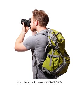 Young Man Tourist Use Camera With Backpack Isolated On A White Background, Caucasian
