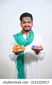 Young man in Tradional wear on occasion of Holi festival of colors.