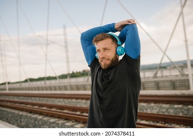 Young man in training during a winter day, a healthy lifestyle - Shutterstock ID 2074378411
