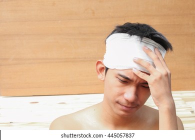 Young Man With Trauma The Head  By Medical Bandage 