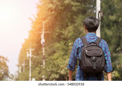 young man is traveling alone with the black bag