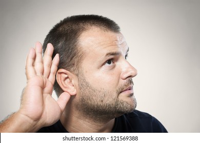 A Young Man Trying To Hearing The Sound Around Him - What Did You Say?