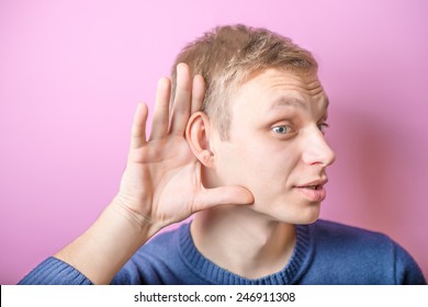 A Young Man Trying To Hearing The Sound Around Him - What Did You Say?