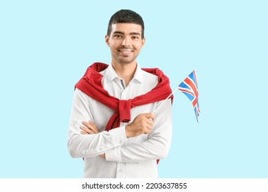 Young Man With UK Flag On Blue Background